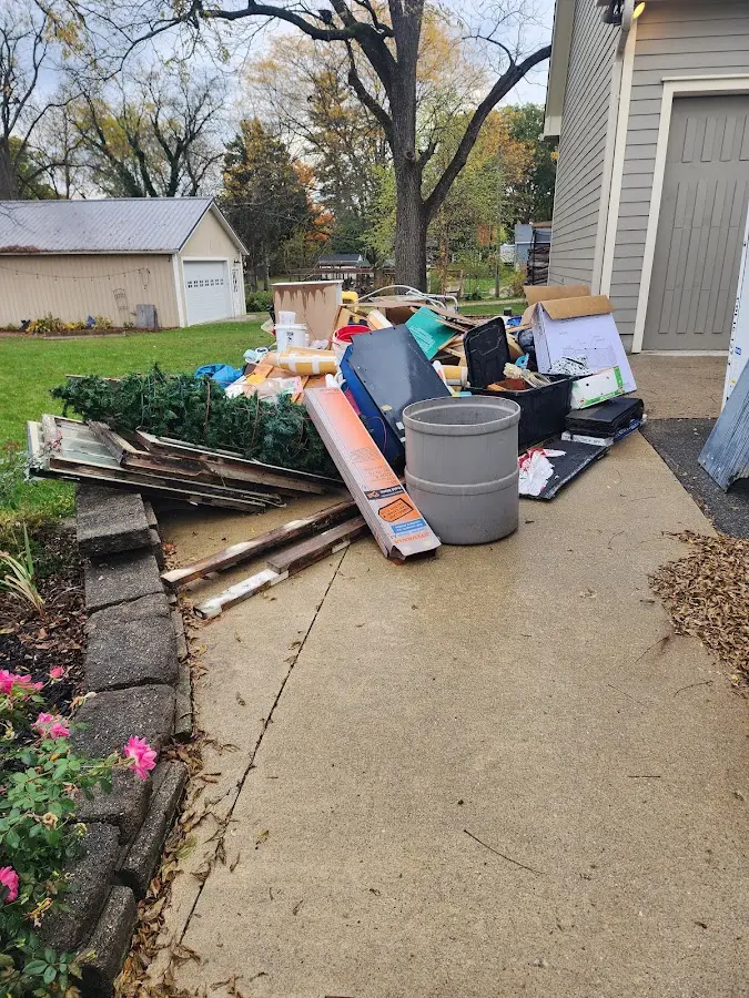 Dumpster being loaded with debris for 30 Yard Dumpster Rental in Waipio Acres